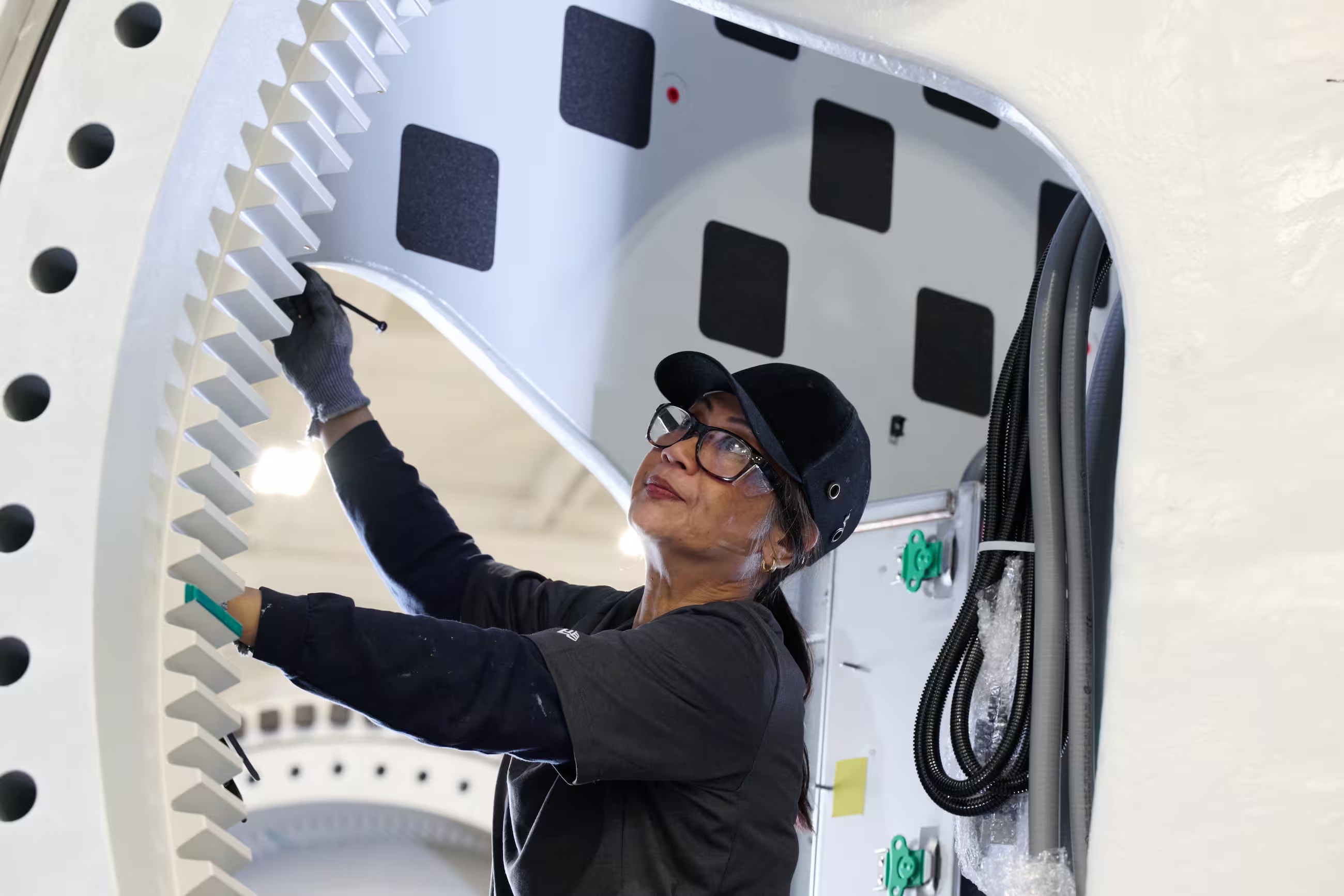 An employee of GE Vernova's Wind segment works on a turbine hub for a Repower order at our manufacturing site in Florida