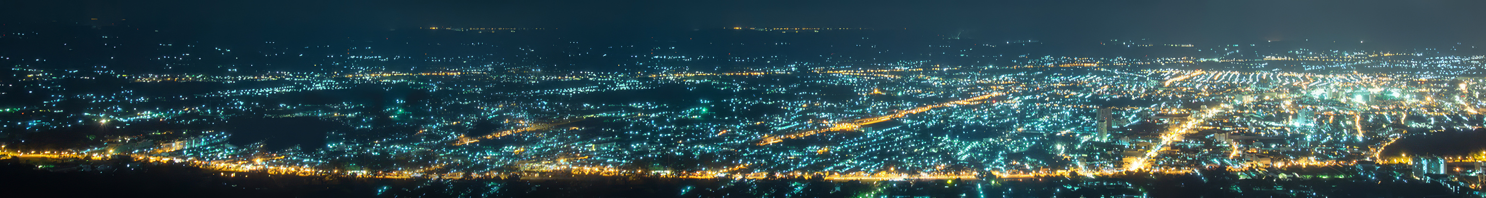 Cityscape at night lit by streetlights representing power distribution networks