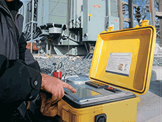 Technician using Kelman Transport X for transformer asset monitoring at substation