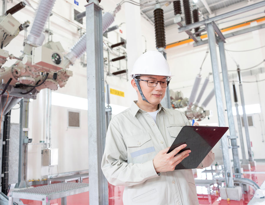 Engineer in front of transformer control room